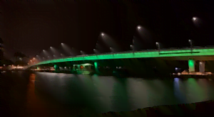 Mandurah Bridge at night with green lights for mental health week.